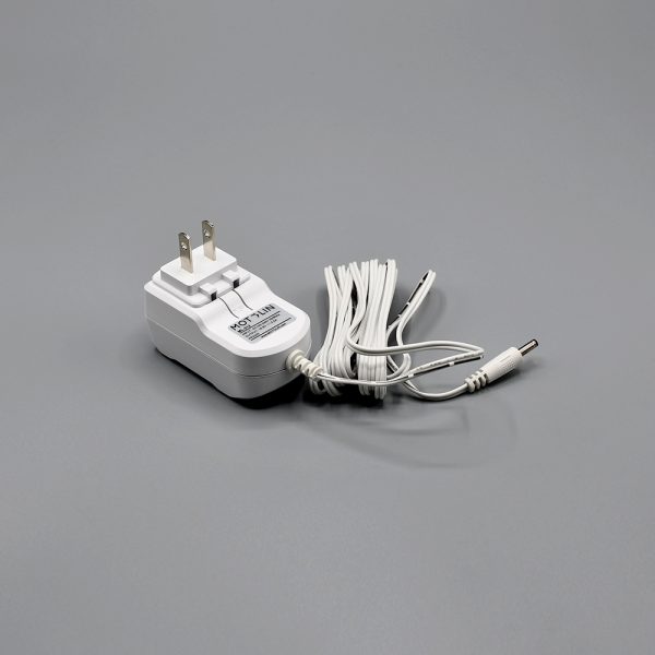 white Fabtex motolin wall charger for roller shade motor