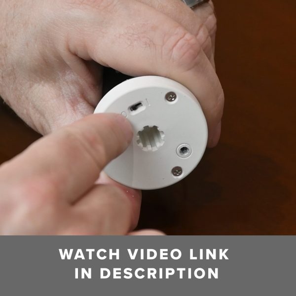 Close up of the Fabtex ML-280BC-USBC-K roller shade motor switch. It directs the viewer to watch the video link in the listing description.