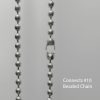 Close-up of a Fabtex chain connector for #10 beaded roller shade chain.