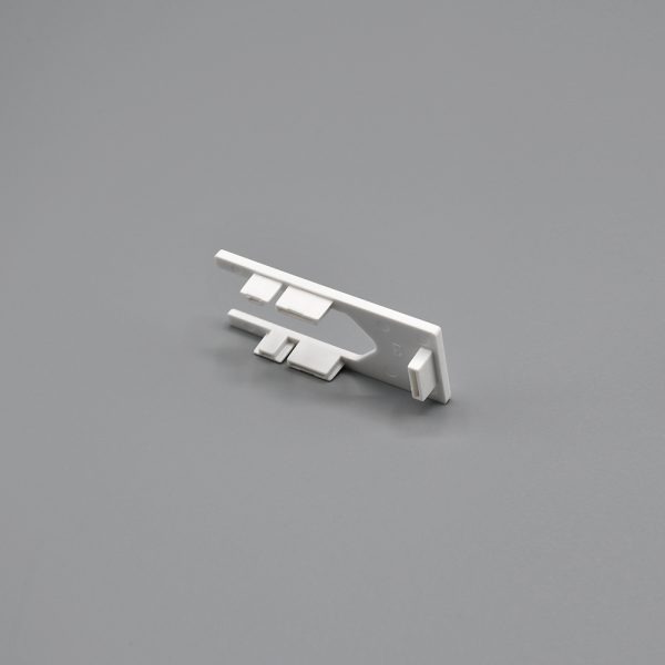 White, Fabtex side channel top end pass for roller shades. Shows the bottom view.